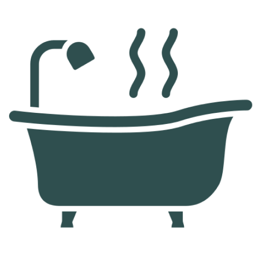 Bathtub with a shower head and steam coming out of it, set against a white background