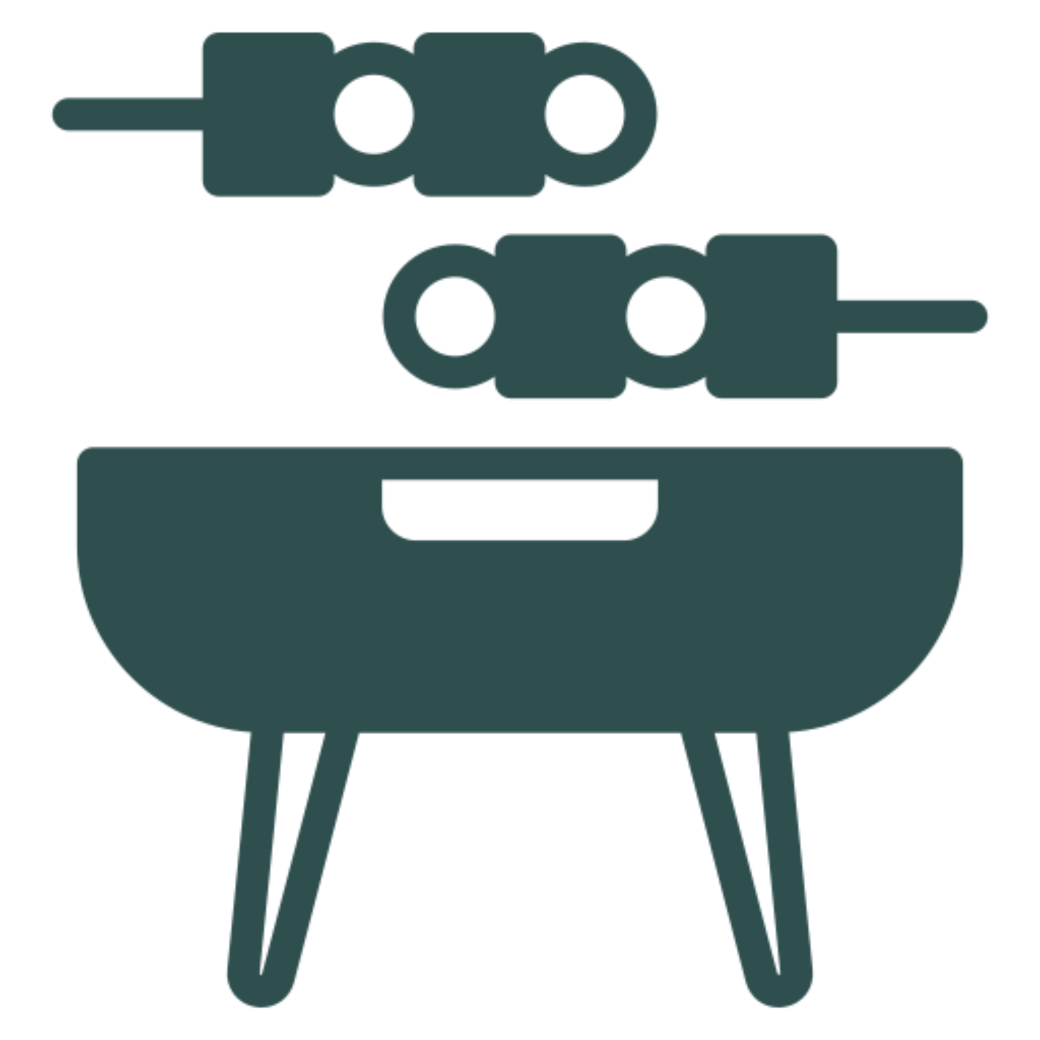 Green barbecue grill with a skewer on top of it, set against a white background