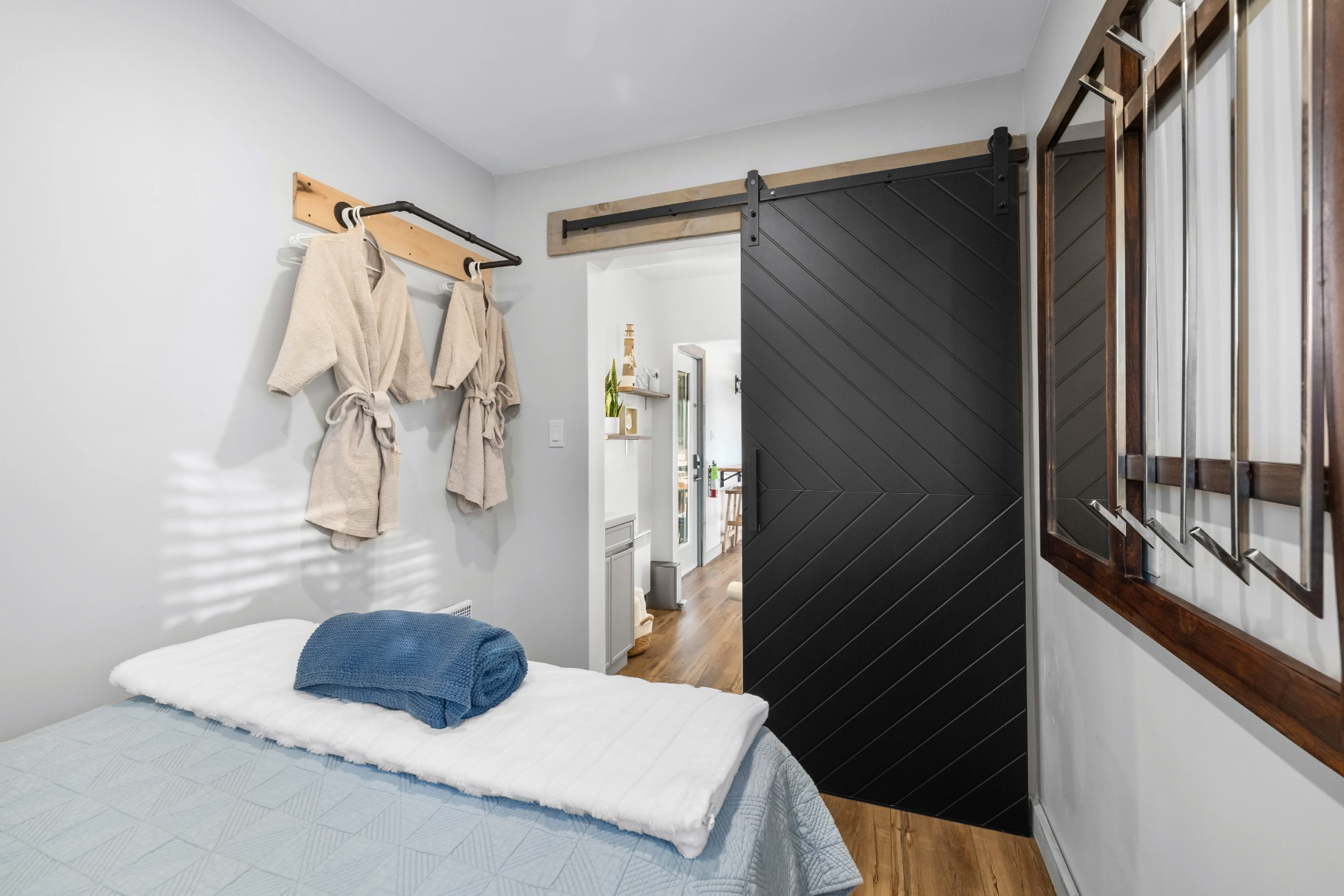 Modern bedroom with barn door and window