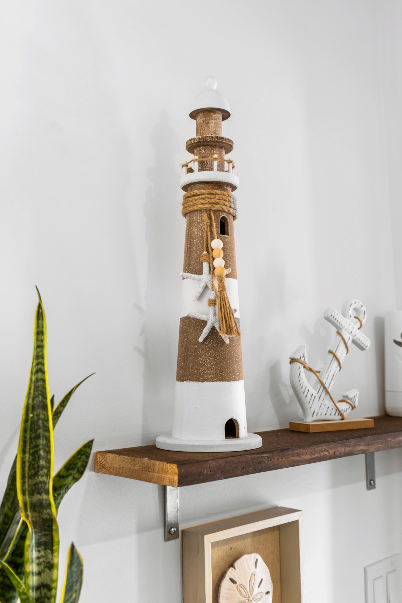 Decorative lighthouse on shelf