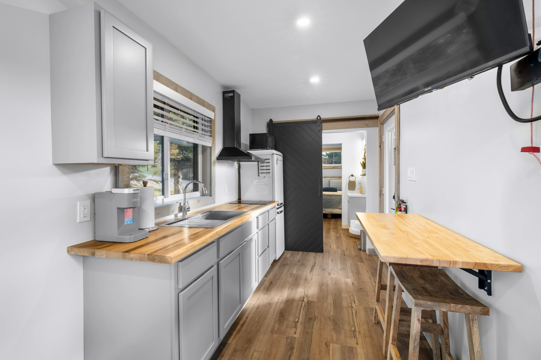 Tiny home kitchen with barn door