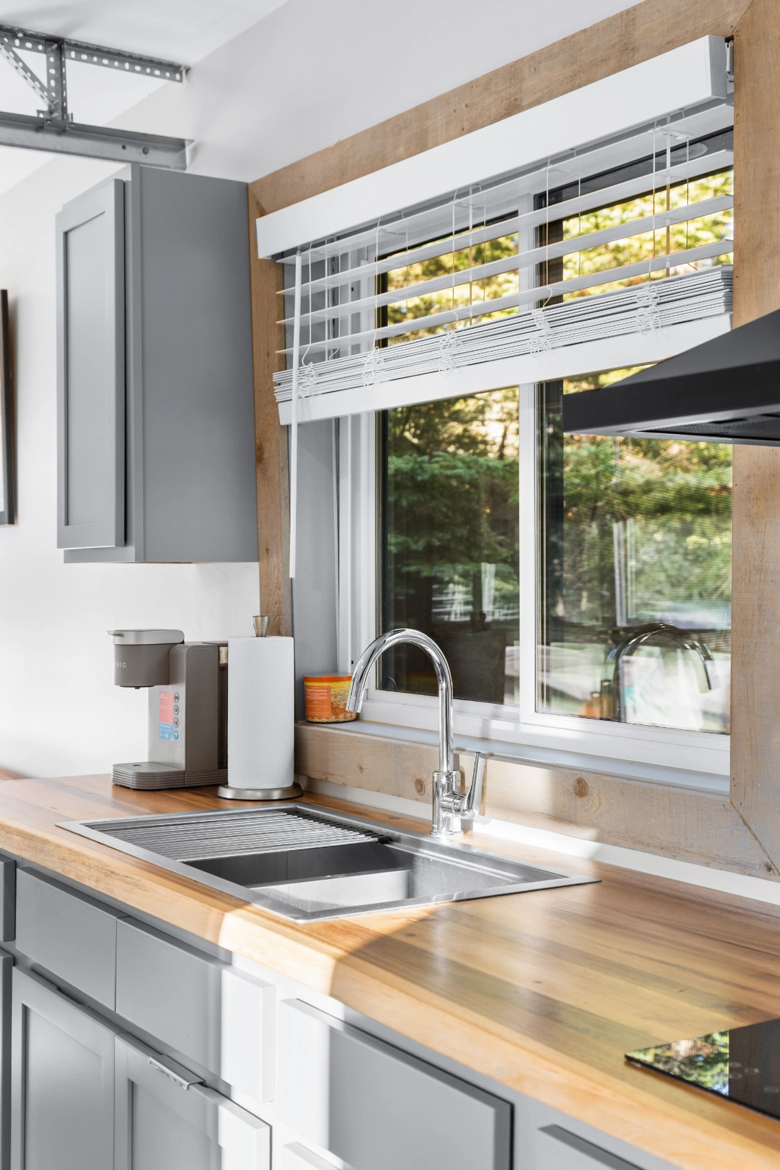 Modern kitchen sink with wood countertop