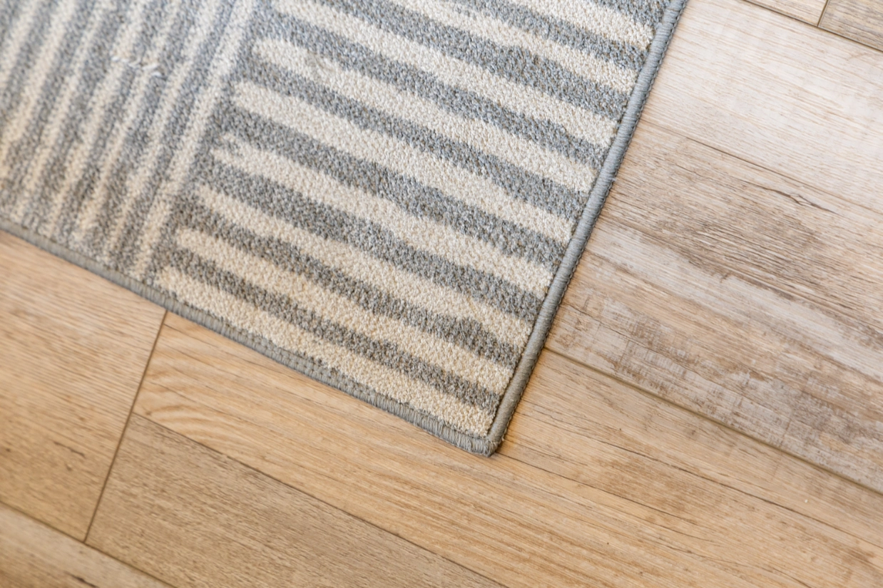 Striped rug on wood floor
