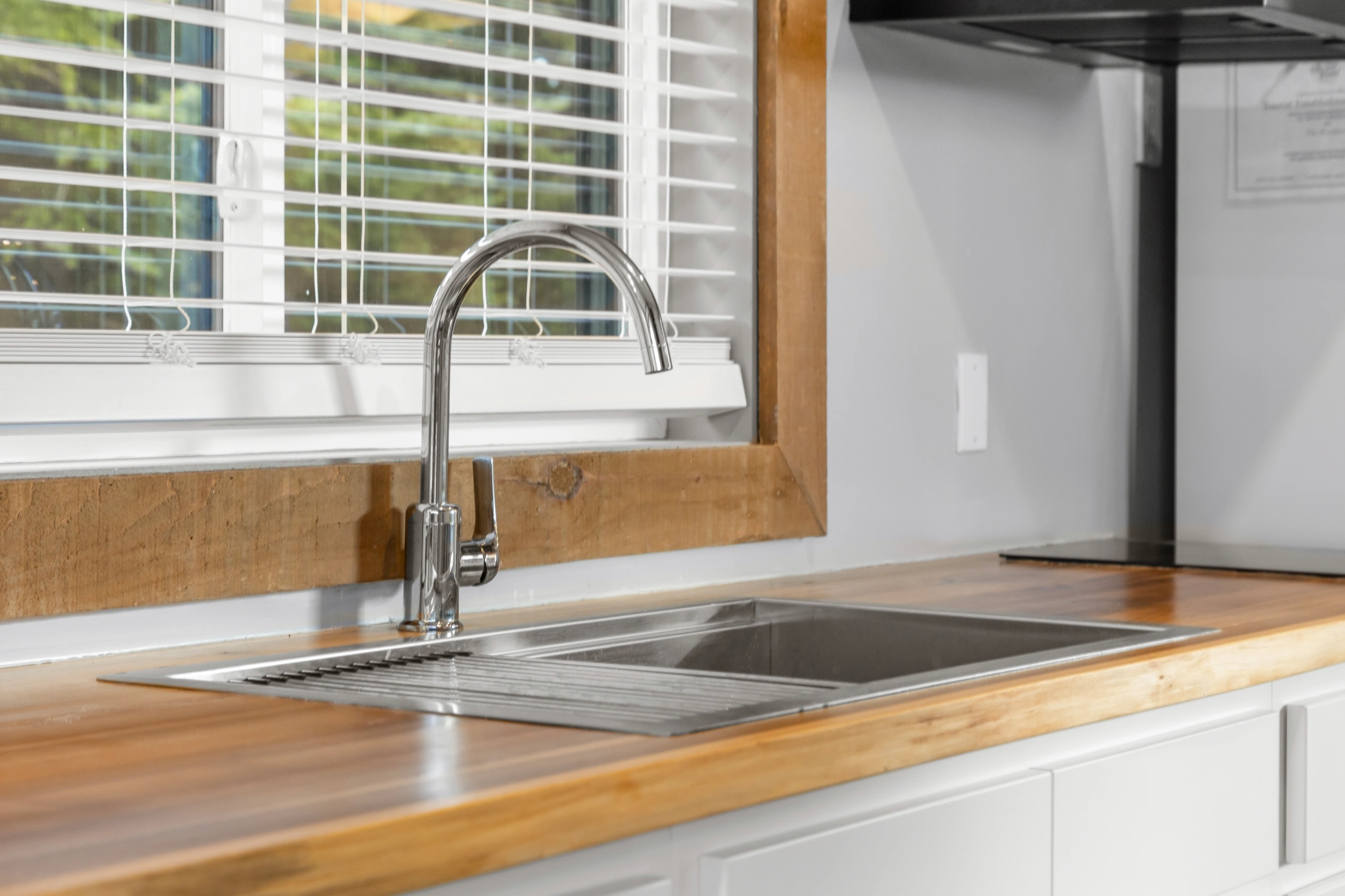 Kitchen faucet and window blinds