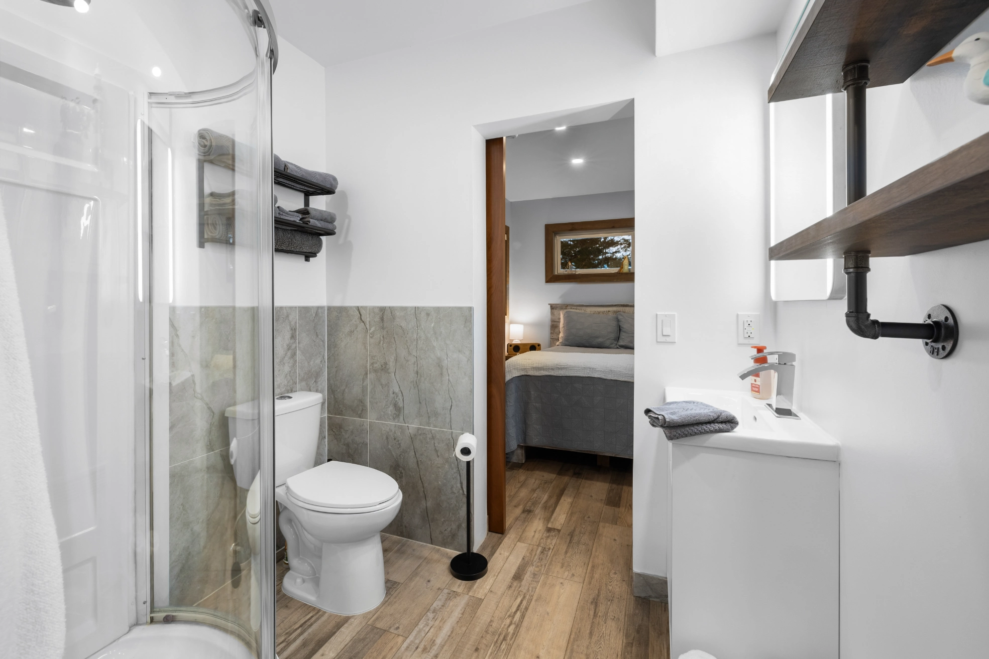 Clean bathroom, wood floor, gray tiles