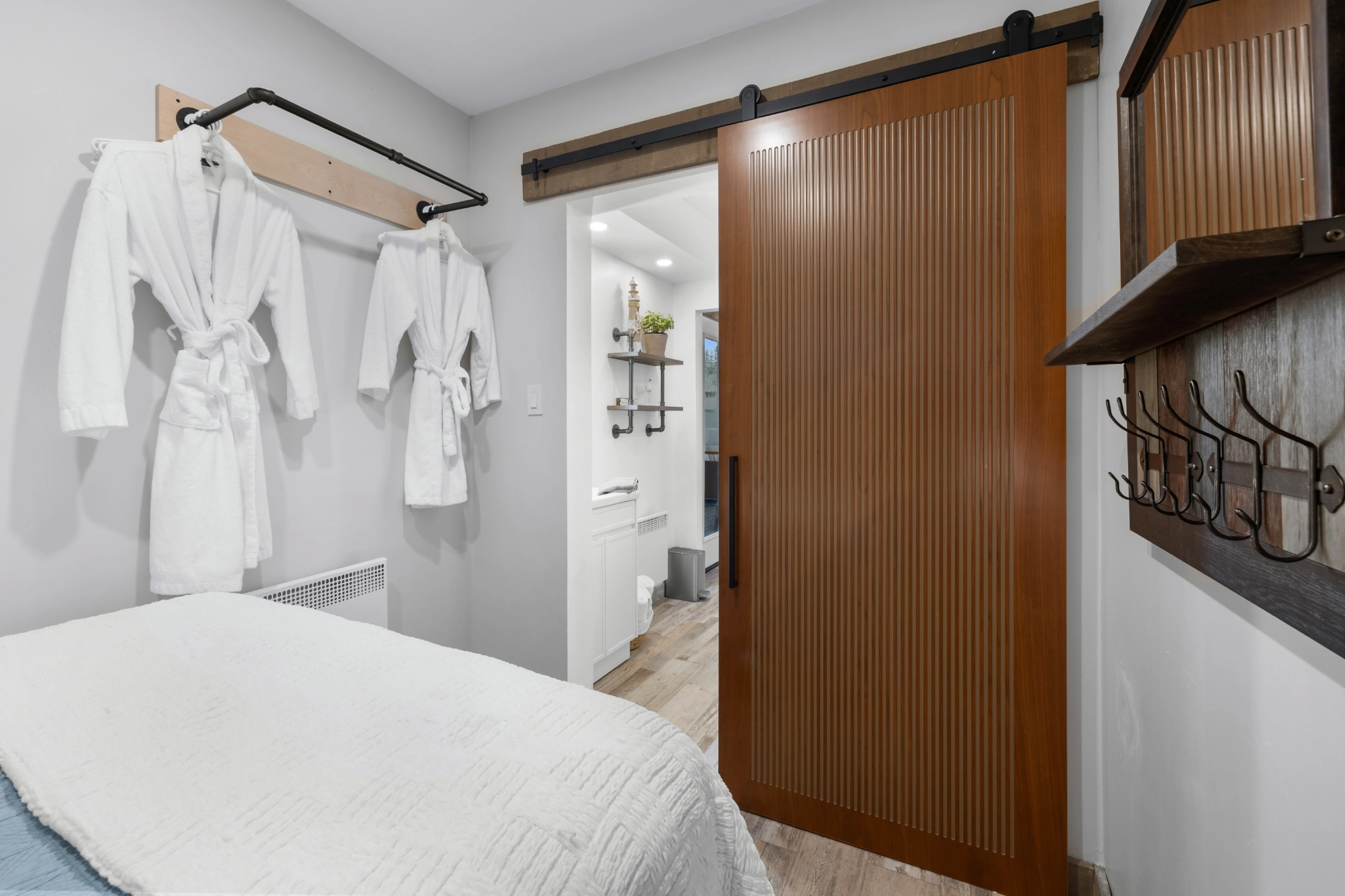 Cozy bedroom with barn door and robes