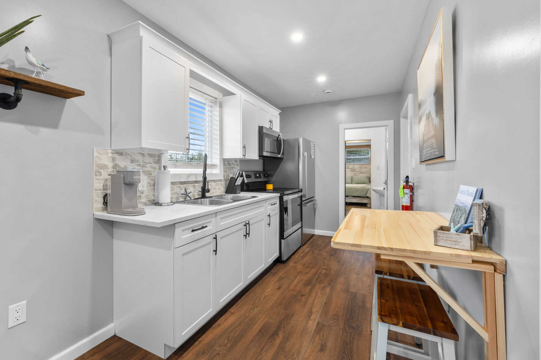 Small kitchen with dining table and bedroom view