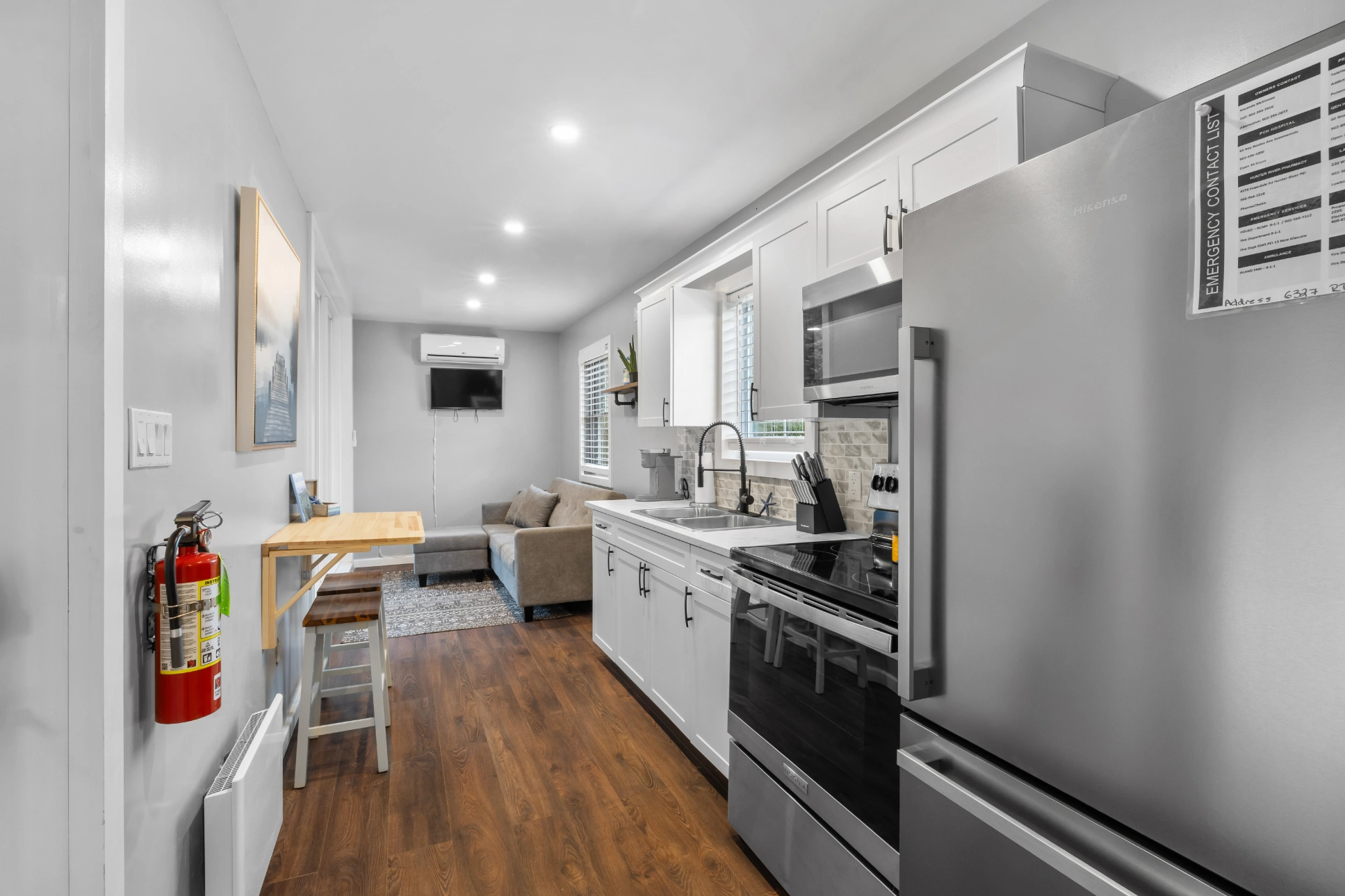Stylish white kitchen with stainless steel appliances