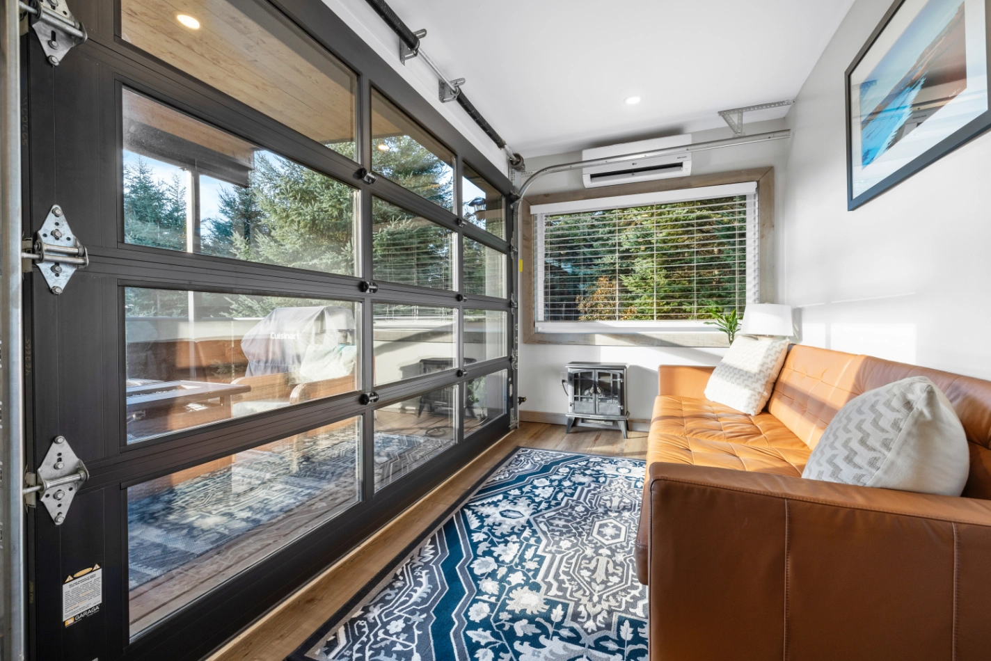 Stylish interior with blue rug and natural light