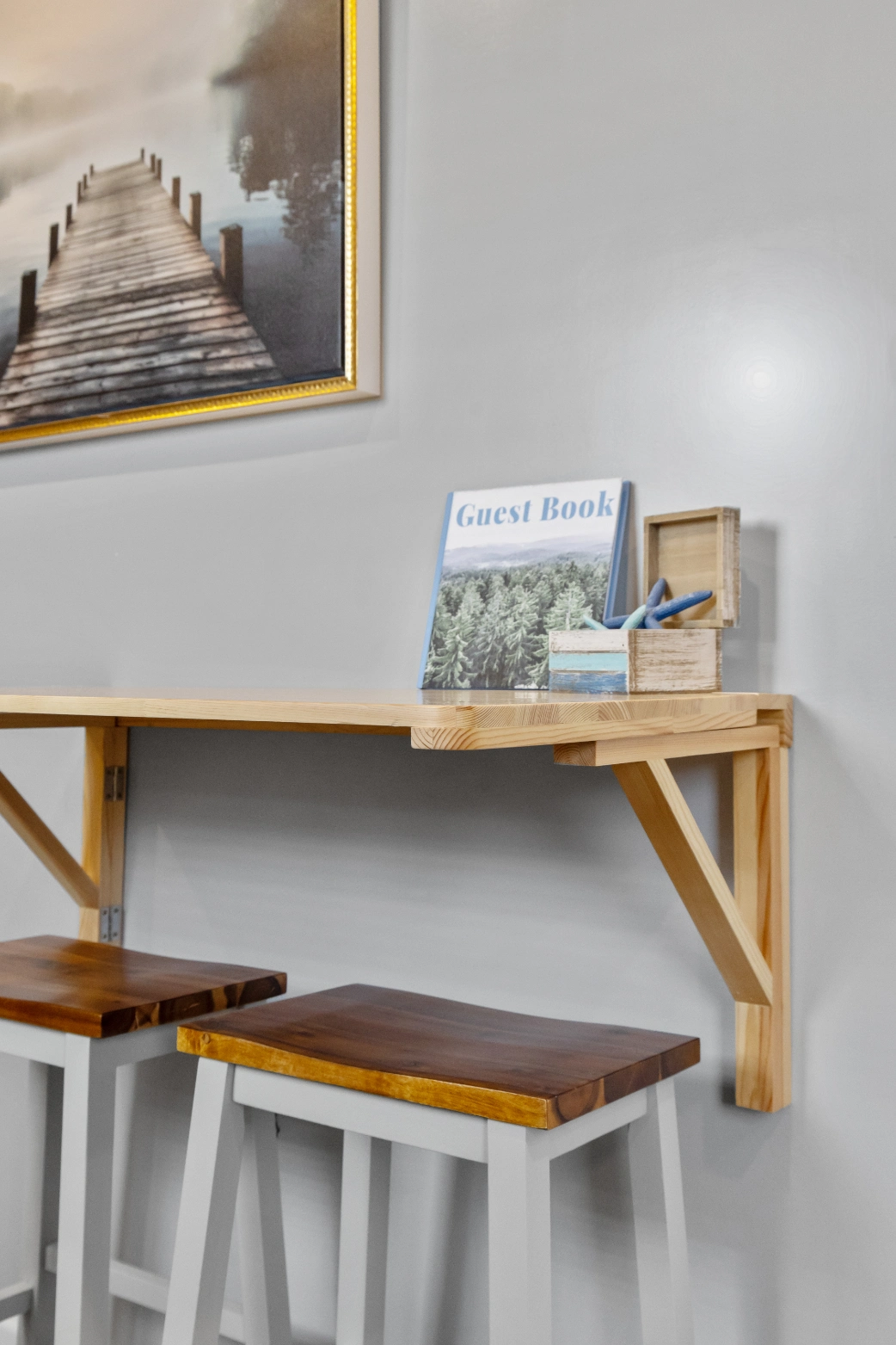 Guest book and decor on shelf