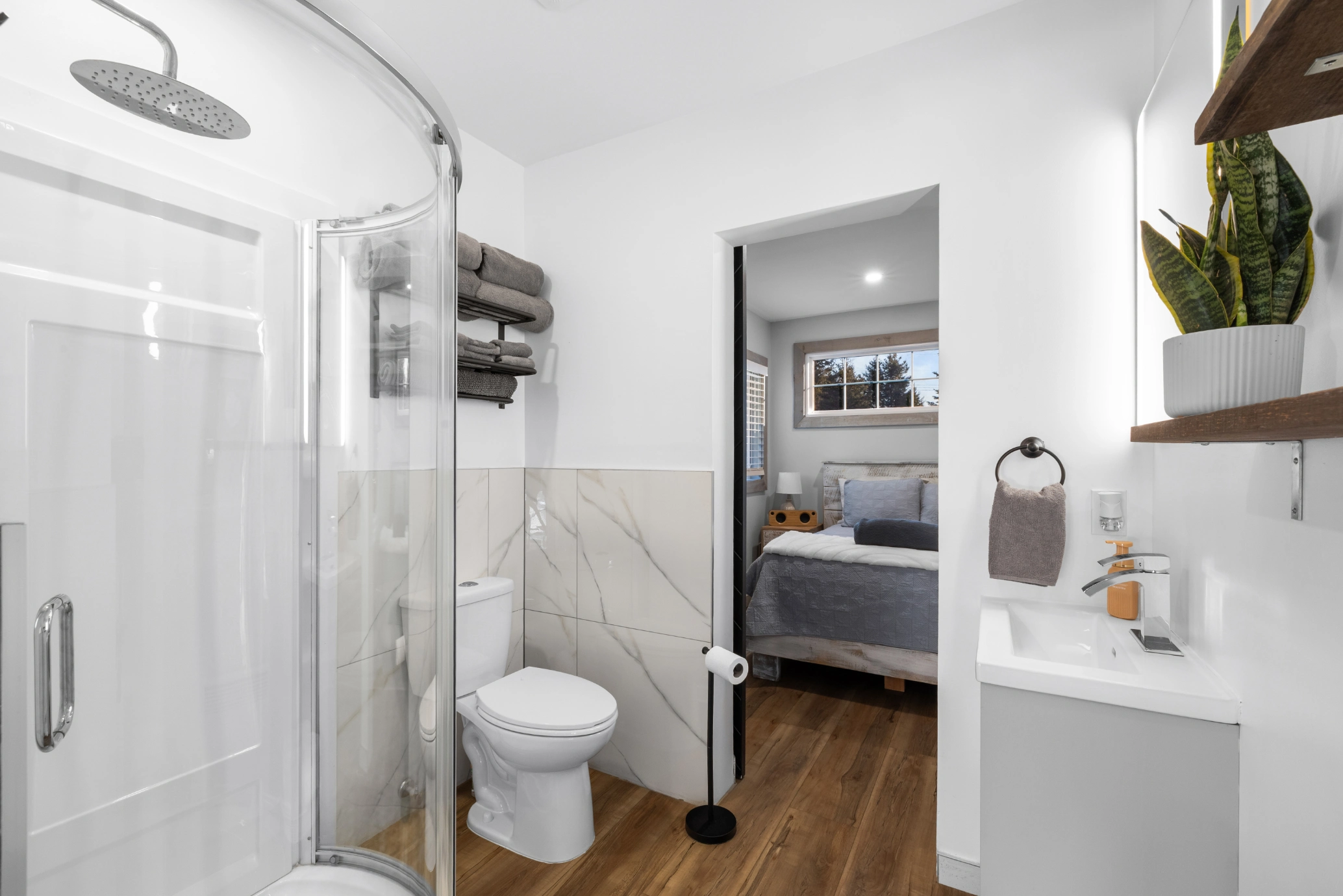 Modern bathroom with shower, toilet, and sink